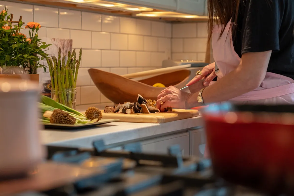 Fresh vegetables being prepared on a kitchen counter in daylight